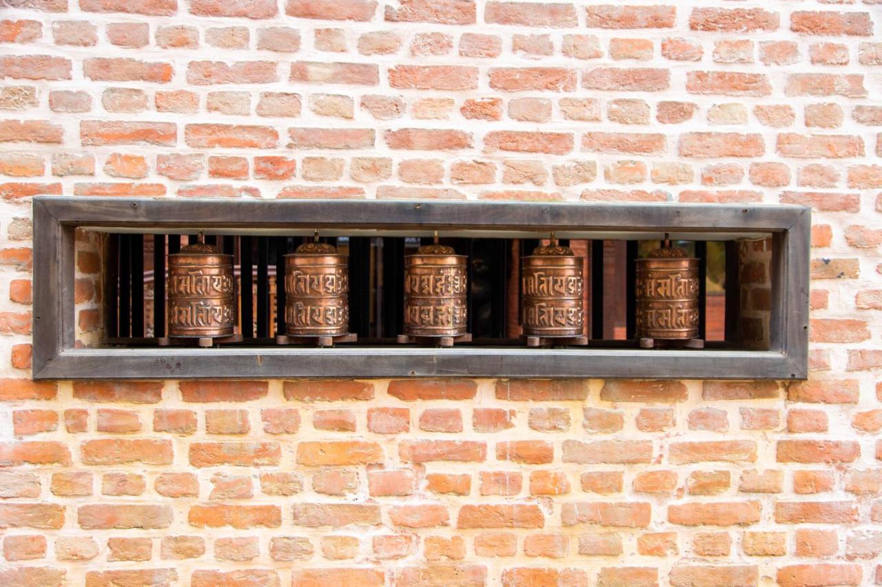 Basera Boutique Hotel Kathmandu Buitenkant foto Prayer wheels at the temple